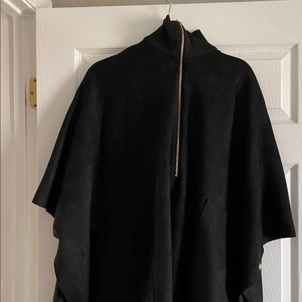 A brand new with tags poncho. Faux suede. Perfect for now!